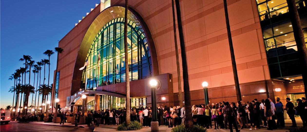 A large building with a crowd of people outside